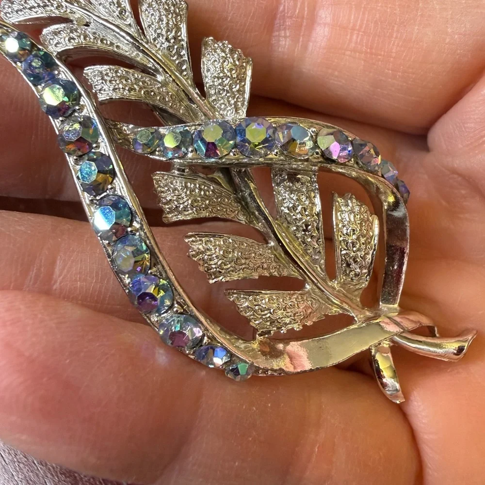Vintage Coro stylized leaf brooch with aurora borealis rhinestones.